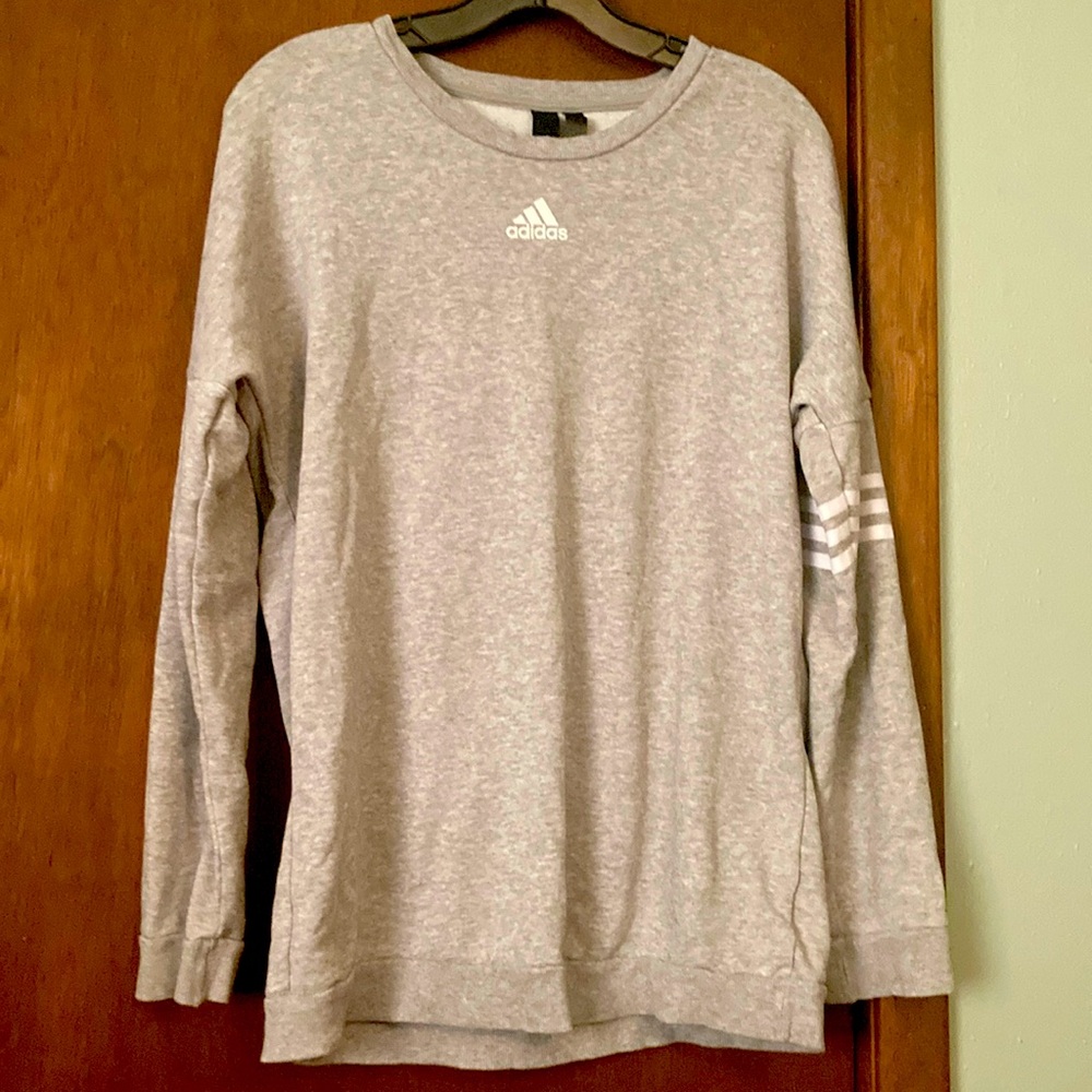 Adidas sweatshirt; “ADIDAS” across the back shoulders.